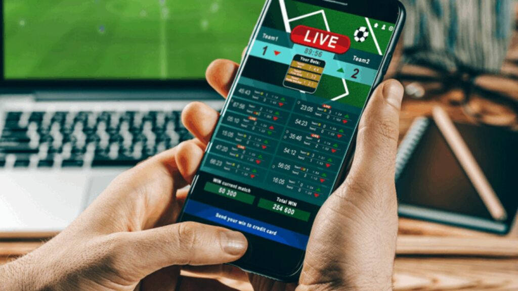 a person who is football betting on smartphone 